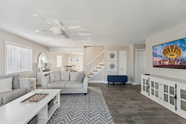 living room featuring dark hardwood / wood-style flooring and ceiling fan