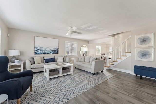 living room with dark hardwood / wood-style floors and ceiling fan