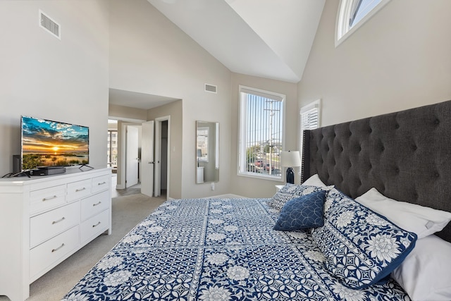 carpeted bedroom with high vaulted ceiling and multiple windows