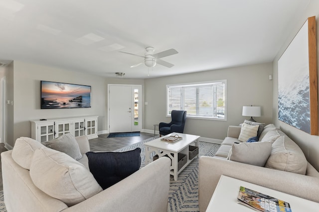 living room featuring hardwood / wood-style flooring and ceiling fan