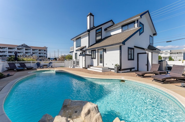 view of swimming pool featuring a patio area