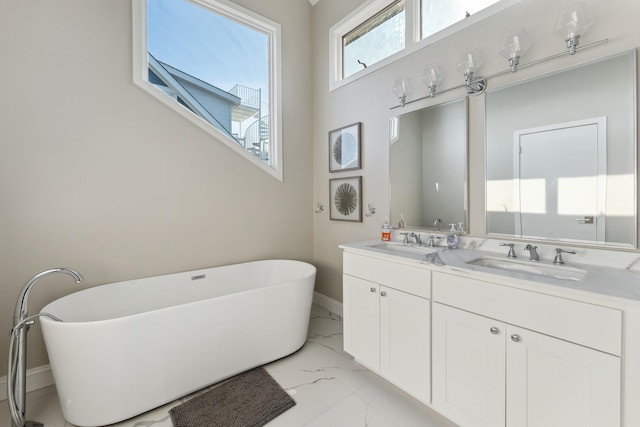 bathroom featuring vanity and a bathing tub