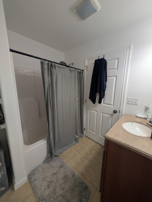 bathroom with visible vents, tile patterned flooring, vanity, and shower / bath combination with curtain