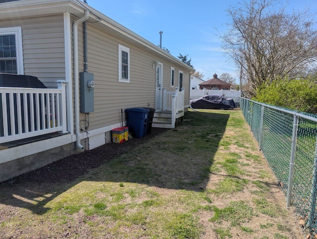 view of home's exterior featuring a fenced backyard and a yard