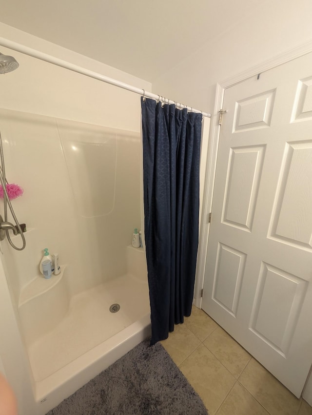 bathroom featuring a shower stall and tile patterned floors