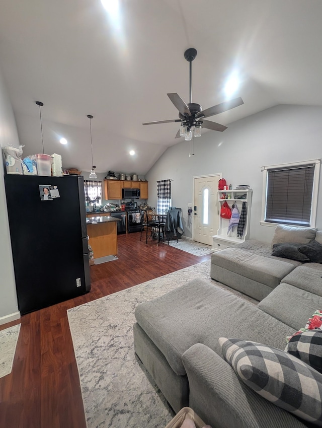 living room featuring recessed lighting, dark wood finished floors, lofted ceiling, and a ceiling fan