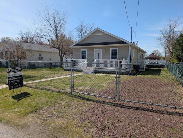 bungalow-style home with fence private yard, a gate, and a front yard