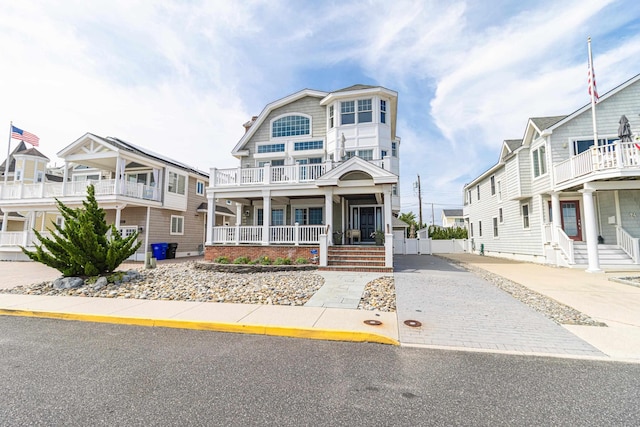 74 W 7th St, Avalon, NJ 08202 - view of front of house with a porch and driveway
