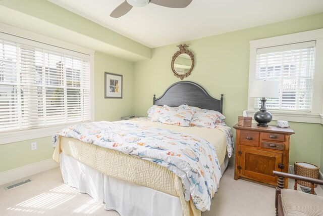74 W 7th St, Avalon, NJ 08202 - bedroom featuring light carpet, multiple windows, and a ceiling fan
