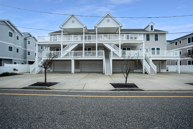 view of front of house with covered porch and a garage