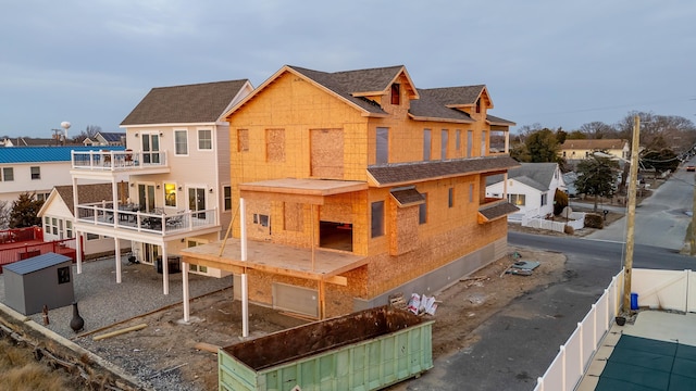 back of house featuring a balcony