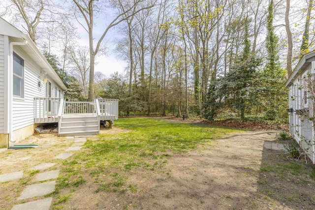 view of yard featuring a deck