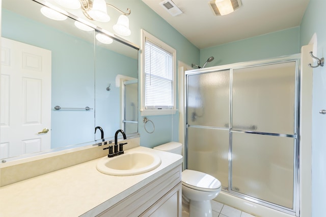 full bathroom with tile patterned floors, toilet, visible vents, a shower stall, and vanity