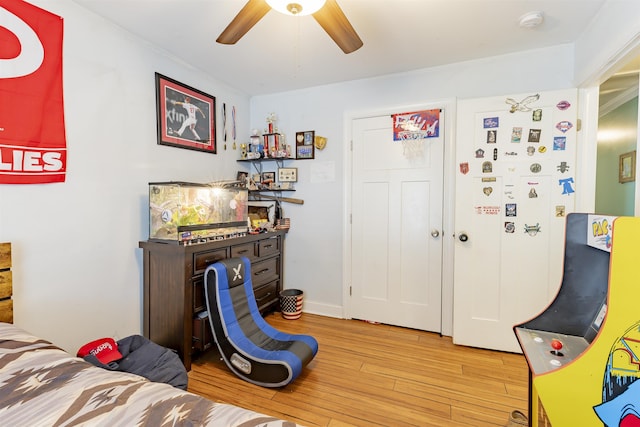interior space with ceiling fan and hardwood / wood-style flooring