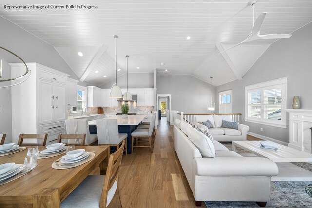 288 86th St, Stone Harbor, NJ 08247 - living room featuring light wood-style flooring, plenty of natural light, high vaulted ceiling, and recessed lighting