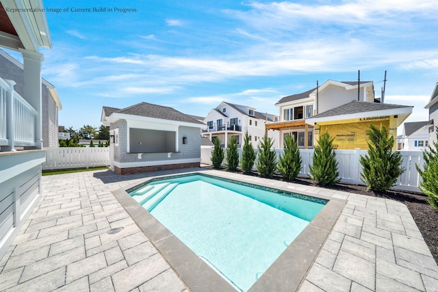 288 86th St, Stone Harbor, NJ 08247 - view of swimming pool with a patio area, a residential view, a fenced backyard, and an outbuilding