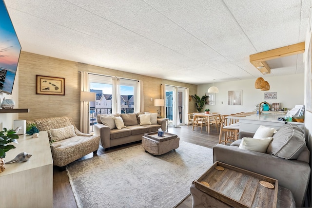 living room featuring wood finished floors and a textured ceiling