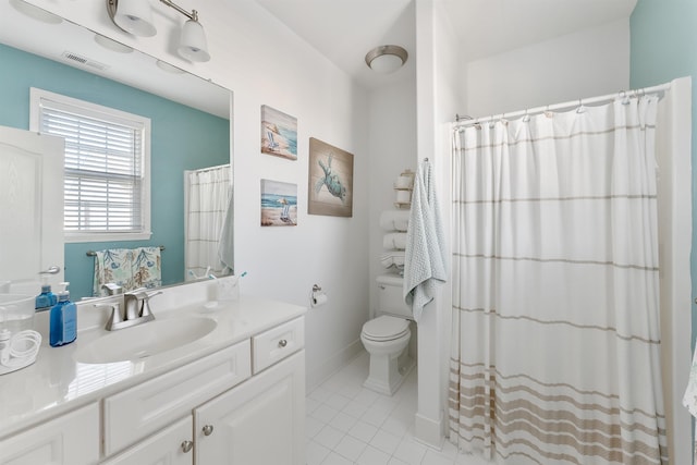 bathroom with toilet, vanity, tile patterned floors, and a shower with shower curtain