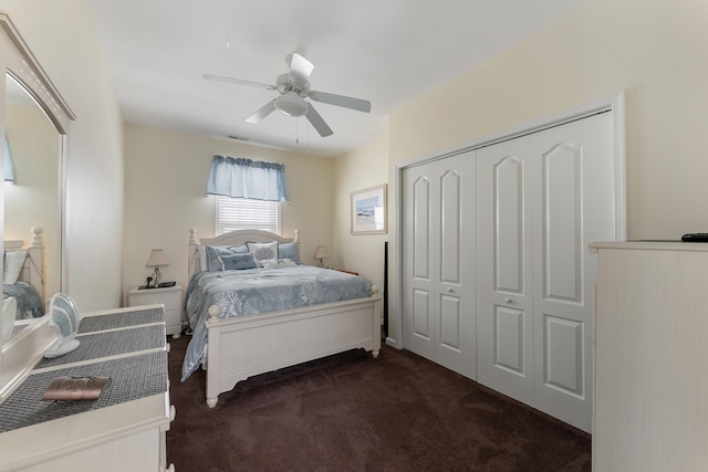 carpeted bedroom with a closet and ceiling fan