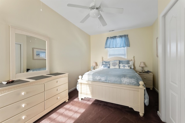 bedroom with dark carpet and ceiling fan