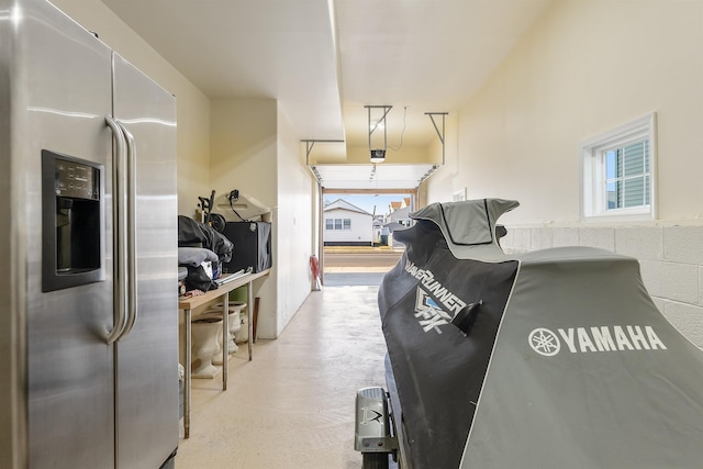 interior space with stainless steel refrigerator with ice dispenser