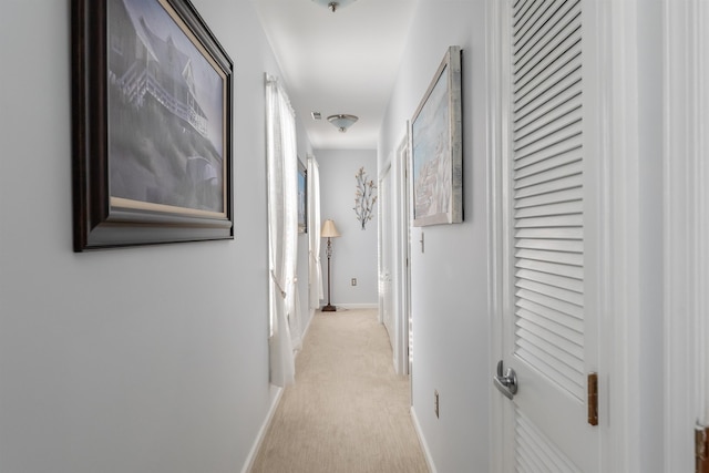 corridor with light colored carpet