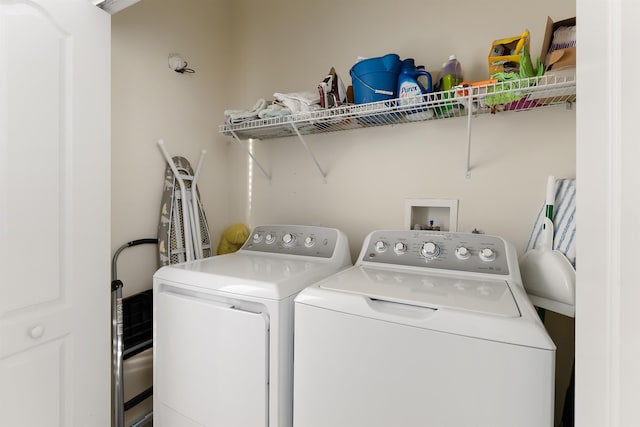 laundry area with independent washer and dryer