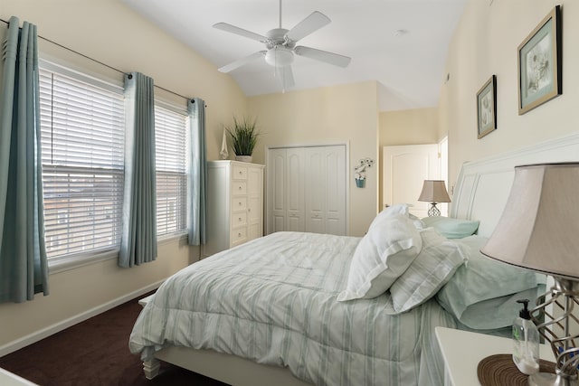 bedroom featuring a closet, vaulted ceiling, and ceiling fan