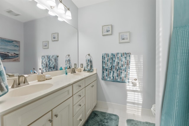 bathroom with tile patterned flooring, vanity, toilet, and a shower with shower curtain