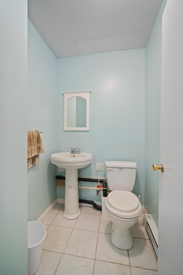 38 Stanhope Rd, Marmora, NJ 08223 - bathroom featuring sink, tile patterned floors, baseboard heating, and toilet