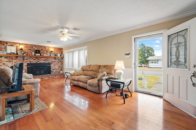 38 Stanhope Rd, Marmora, NJ 08223 - living room featuring ornamental molding, plenty of natural light, and light hardwood / wood-style floors