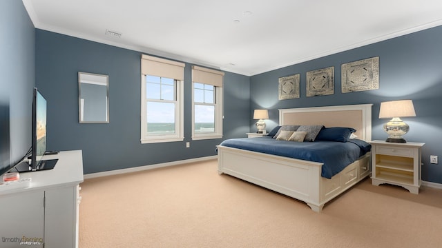 bedroom featuring ornamental molding, light colored carpet, visible vents, and baseboards