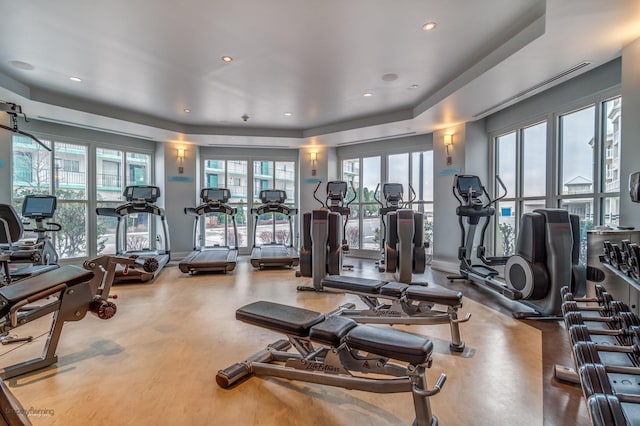 exercise room with plenty of natural light and recessed lighting