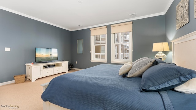 bedroom with light colored carpet, visible vents, crown molding, and baseboards