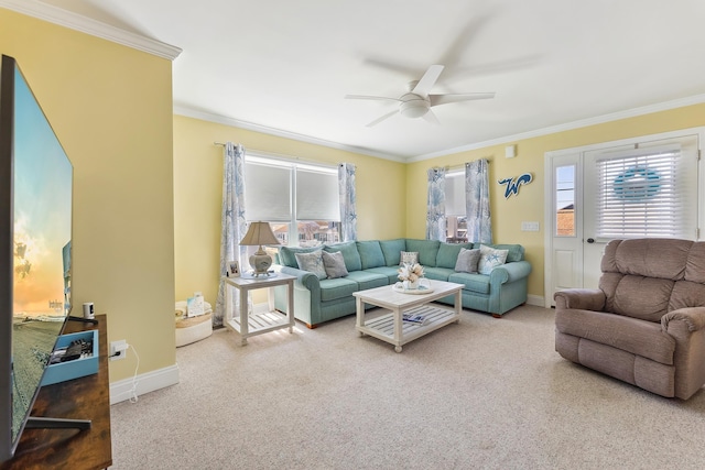 living area with crown molding, ceiling fan, and carpet