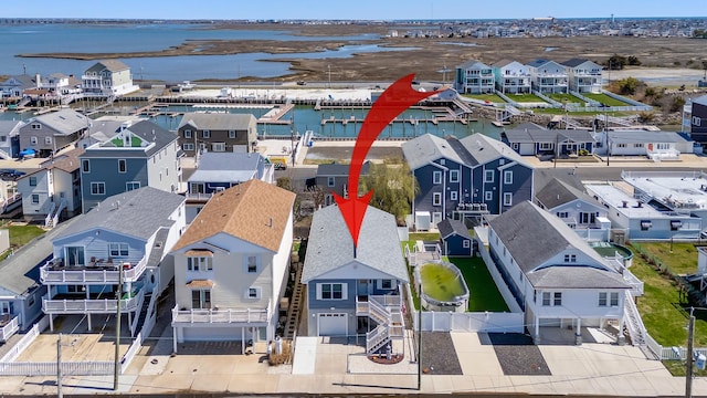 aerial view with a residential view and a water view