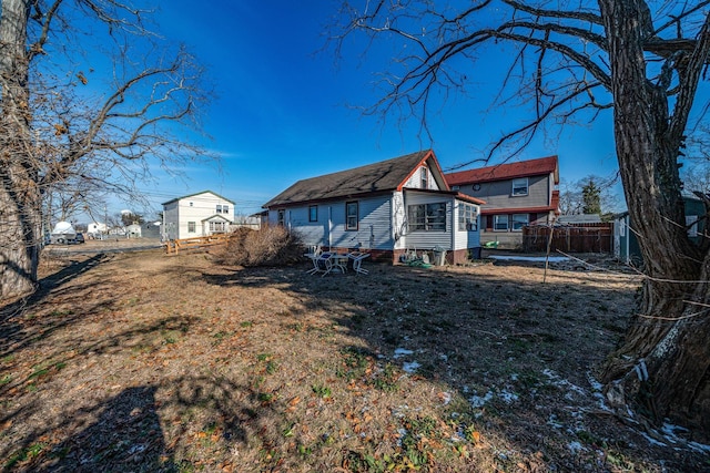 back of property with a yard