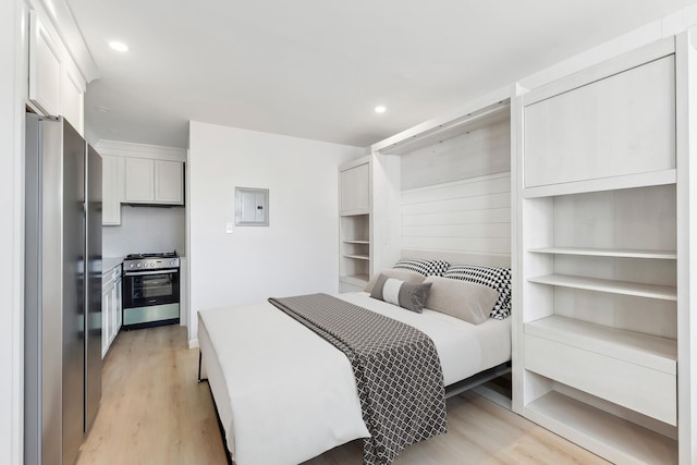 233 E Juniper Ave Unit A, Wildwood, NJ 08260 - bedroom with freestanding refrigerator, electric panel, light wood-style flooring, and recessed lighting