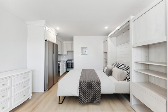 233 E Juniper Ave Unit A, Wildwood, NJ 08260 - bedroom with stainless steel fridge, light wood-style flooring, and recessed lighting