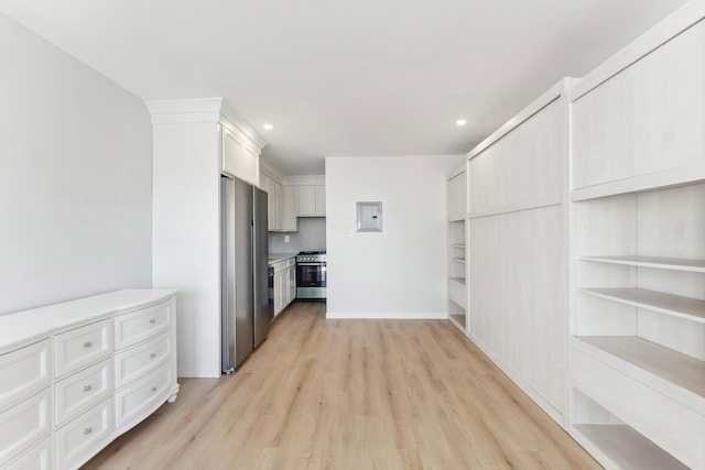 233 E Juniper Ave Unit A, Wildwood, NJ 08260 - kitchen with appliances with stainless steel finishes, light wood-style flooring, white cabinets, electric panel, and recessed lighting