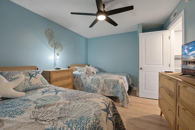 bedroom featuring light hardwood / wood-style flooring and ceiling fan