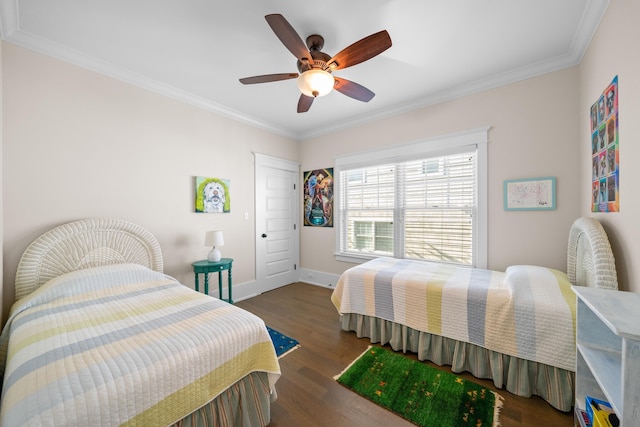 bedroom featuring ornamental molding, dark hardwood / wood-style floors, and ceiling fan