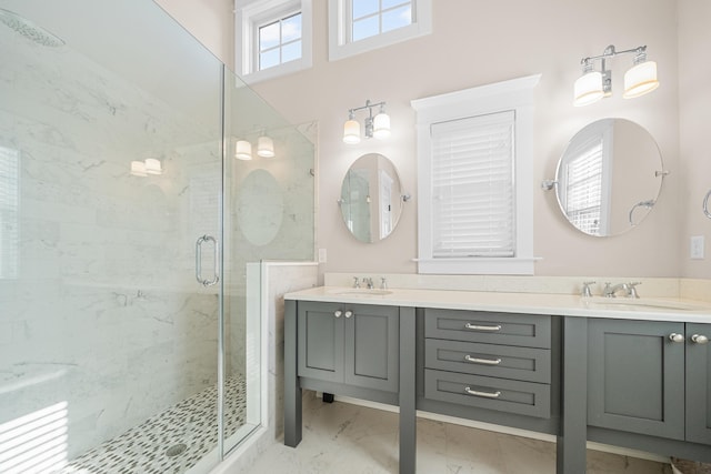 bathroom with vanity and a shower with door