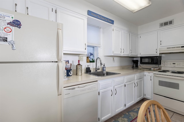 kitchen featuring white appliances, premium range hood, tile patterned floors, sink, and white cabinetry