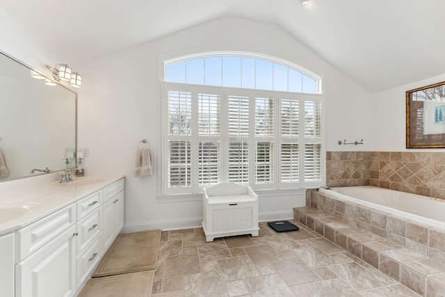 3005 Shore Dr, Cape May Beach, NJ 08251 - bathroom featuring a sink, double vanity, vaulted ceiling, and a garden tub