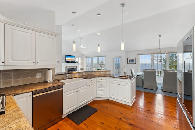 3005 Shore Dr, Cape May Beach, NJ 08251 - kitchen with stainless steel dishwasher, wood finished floors, a sink, and a healthy amount of sunlight