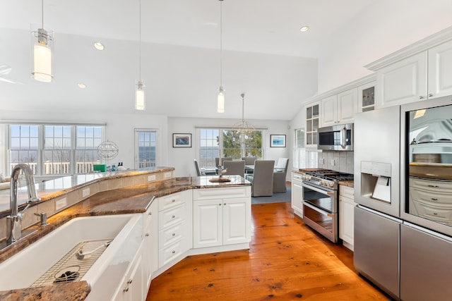 3005 Shore Dr, Cape May Beach, NJ 08251 - kitchen featuring stainless steel appliances, glass insert cabinets, white cabinets, and a sink