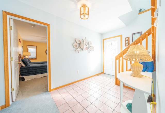 entrance foyer featuring light carpet