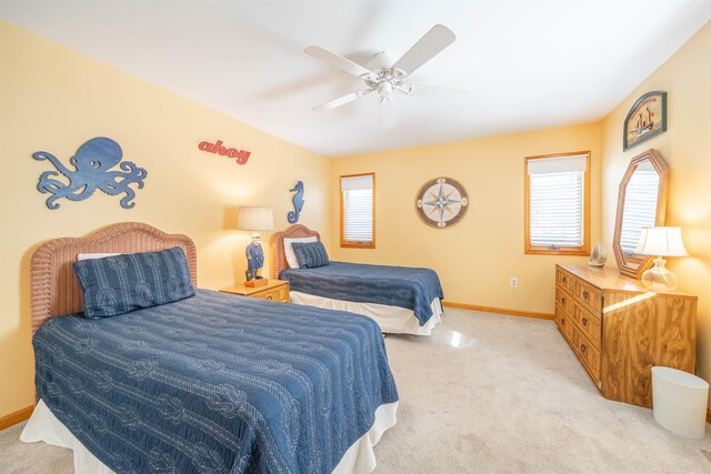 living room with light carpet and ceiling fan