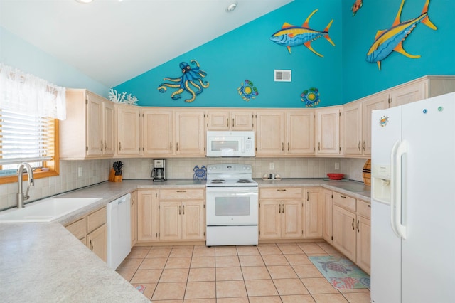 kitchen featuring light tile patterned floors, sink, white appliances, and backsplash